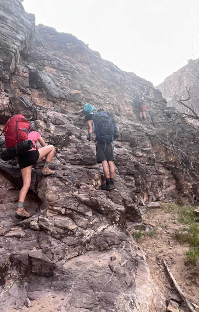 Hikers climb the Papago Wall.