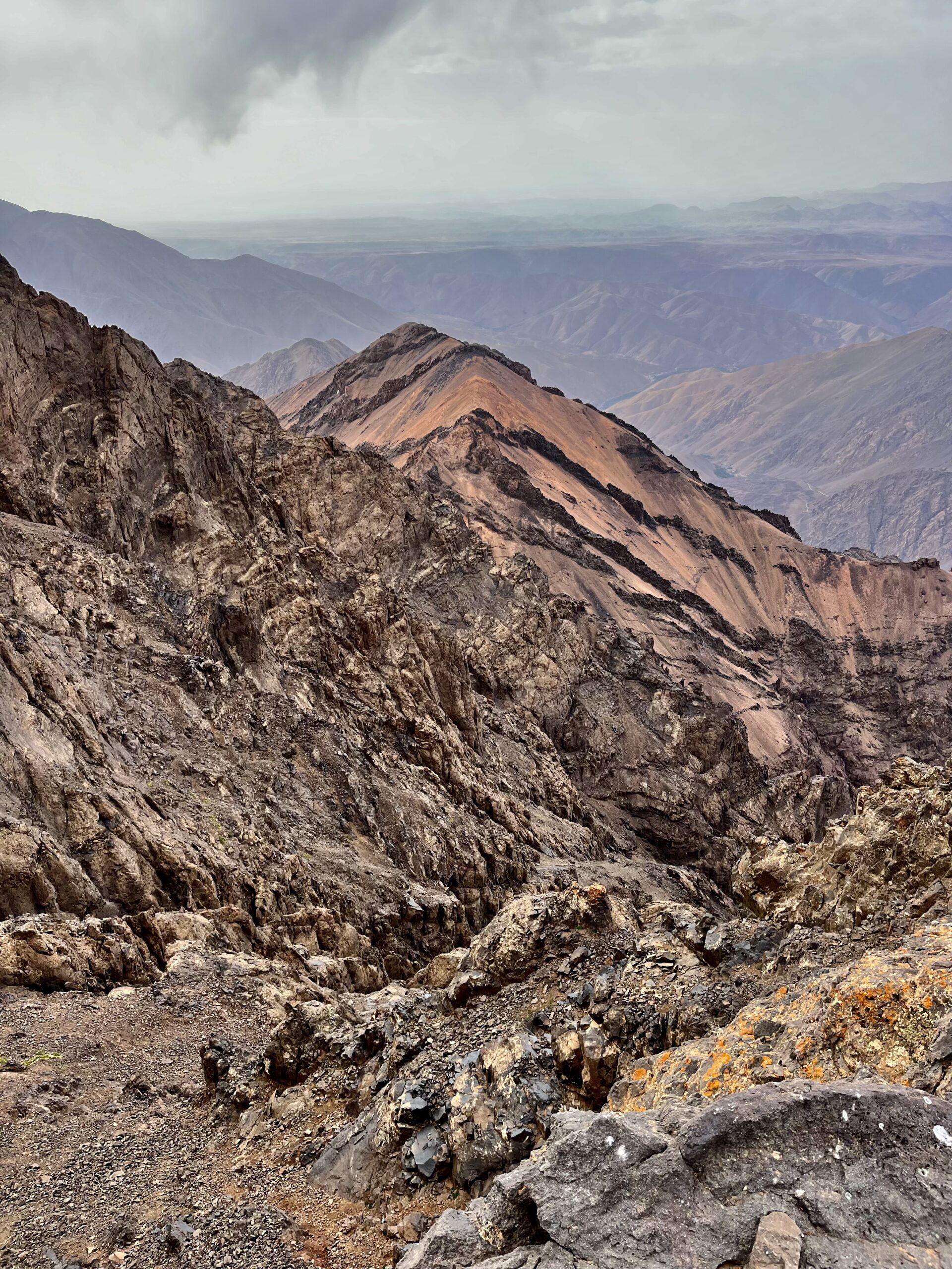 A geologically interesting arm descends off a mountain.