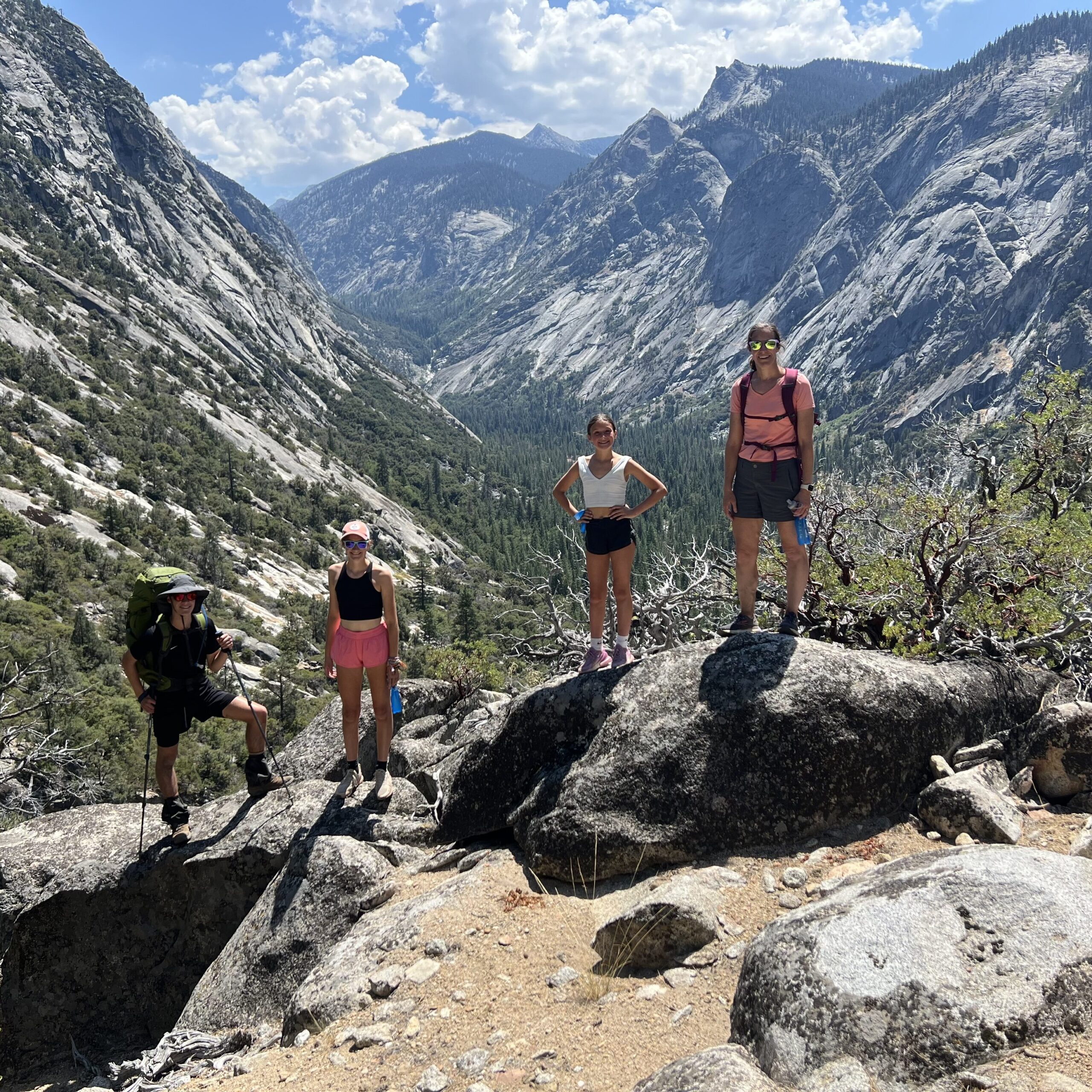 Us with the view of Kings Canyon from the ledge.