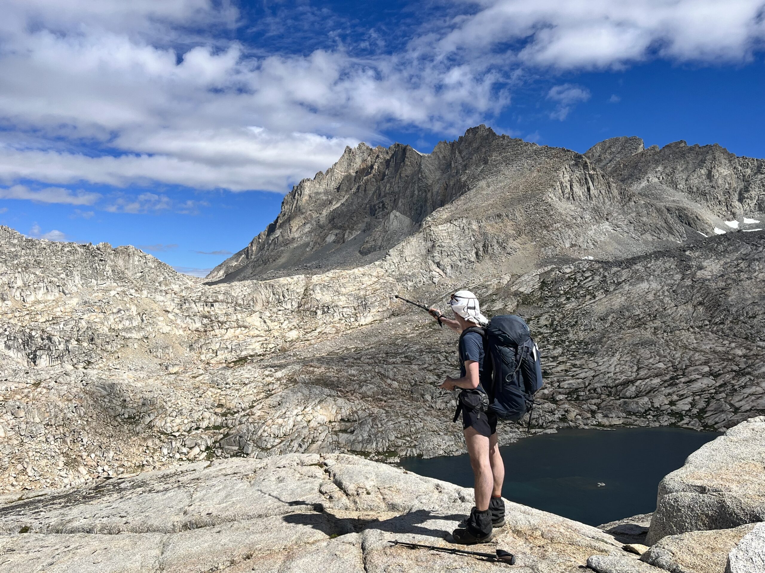 Jim pointing toward Potluck Pass